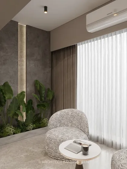 A serene nook that blends minimalism with natural warmth. The muted taupe and grey palette forms a grounding base, while earthy stone textures and matte finishes lend a raw elegance. The curved archway and patterned seating add a cozy softness.