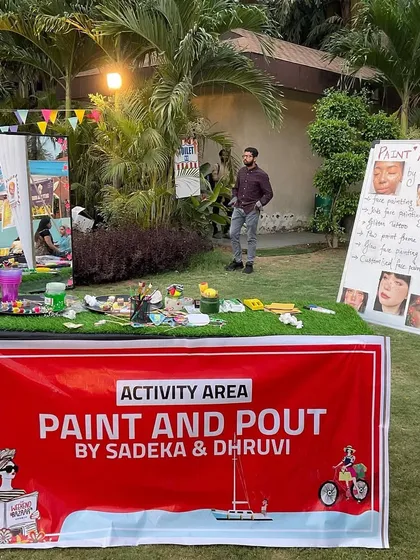 Here’s a peek at our setup for an outdoor event. We bring a full activity area, complete with a banner and a display of our face paint designs, creating a professional and inviting art station for your guests.