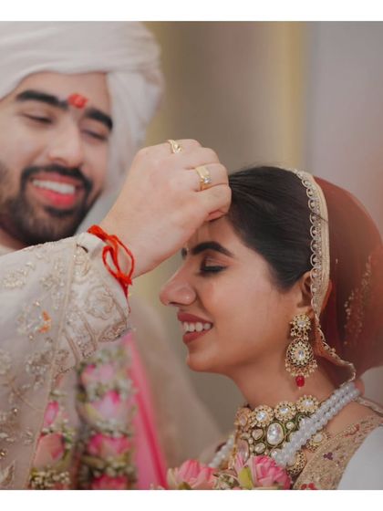 The heartfelt moment when the groom applies the sindoor, a powerful and emotional ritual in a Hindu wedding ceremony.