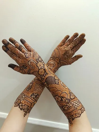 A creative pose with crossed arms, showing how the design flows seamlessly from one arm to the other.