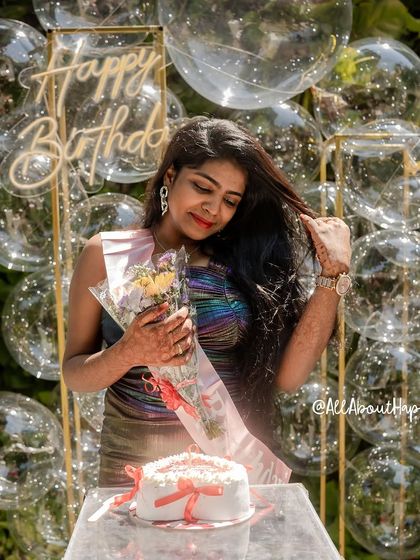 The birthday girl looking radiant as she celebrates with our stunning bubble backdrop.