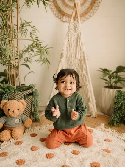 A happy clap! This little boy is having so much fun during his studio photoshoot.