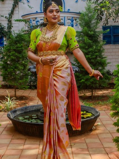 A model from a collaborative shoot, wearing our temple jewellery with a modern puff-sleeve blouse.