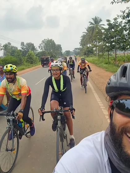 A dynamic selfie taken mid-ride, capturing the joy and energy of riding in a group during the Rajyotsava 200K.