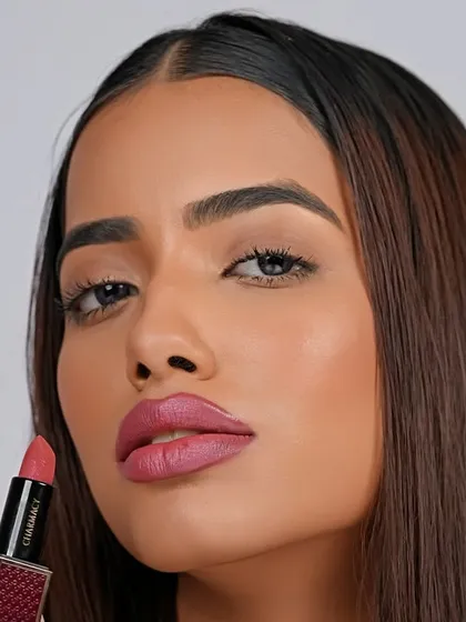 A clean, striking beauty shot for a lipstick campaign, focusing on the product and the model's flawless application. This demonstrates my ability to create sharp, commercial images for cosmetic brands.