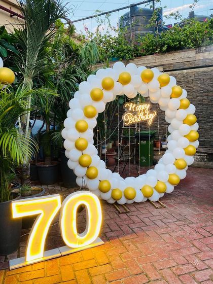 A full view of the 70th birthday outdoor setup.