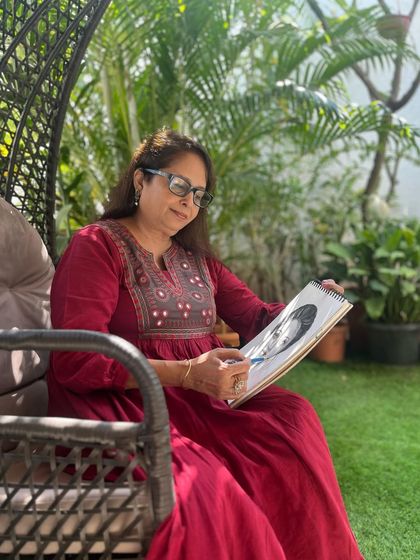 Here I am in my garden, taking a moment for myself with my sketchbook. Art is not just my profession; it's my own therapy and a way of life. Practicing regularly takes me to a meditative state and keeps my own creative spirit alive.