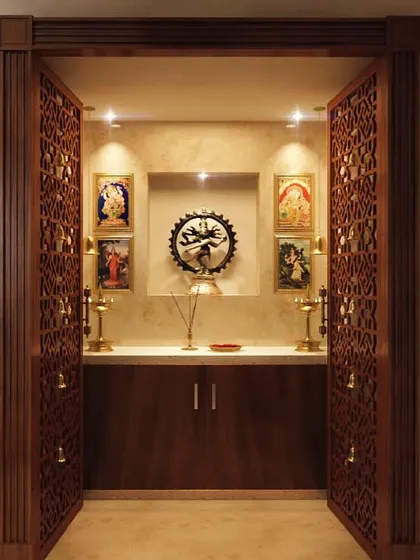 A pooja room is the heart of a home. We design sacred spaces that are both beautiful and tranquil, like this unit featuring intricate CNC-carved doors, warm spotlighting, and a serene backdrop for prayer and meditation.