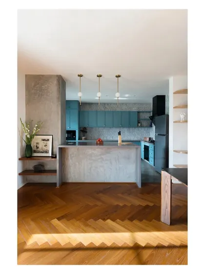 The kitchen in the 'House of Skye' showcases my love for materials. A custom in-situ terrazzo waterfall counter acts as a breakfast island, seamlessly connecting to the reclaimed teak herringbone floor. This junction of textures and patterns is where I believe a space finds its unique character.