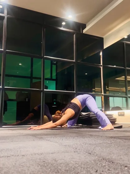 The downward-facing dog is a foundational yoga pose that I use to stretch the hamstrings, calves, and shoulders while building strength in the arms and upper back.