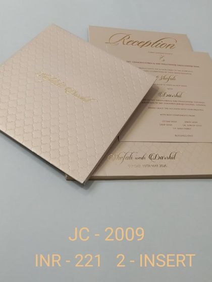 A simple and chic invitation with a textured, pale pink finish and gold foil typography. This two-insert card is perfect for a modern, minimalist celebration.