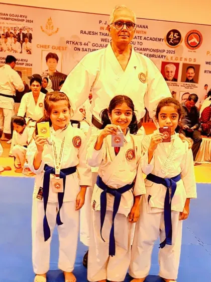 A group of our youngest champions with Kyoshi Sensei. Their smiles and medals are a testament to their hard work and the fun they have while learning.
