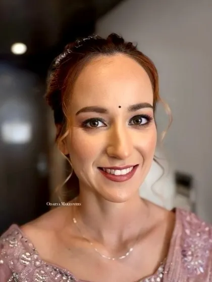 A close-up portrait. I used soft, neutral tones to enhance her fair complexion and beautiful features.