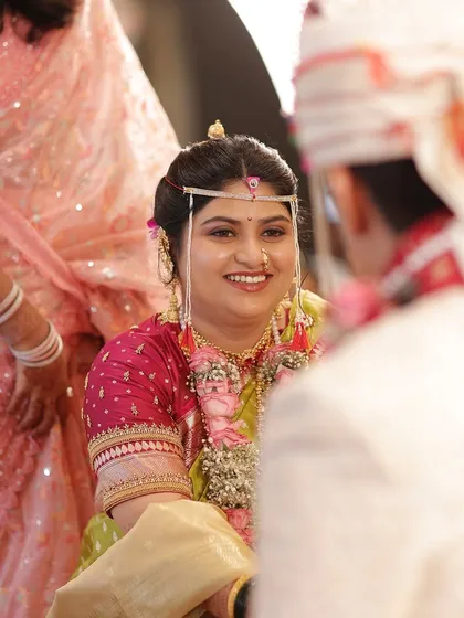 A candid moment during the wedding ceremony. Her makeup is soft and elegant, designed to highlight her features naturally while keeping the essence authentically bridal.