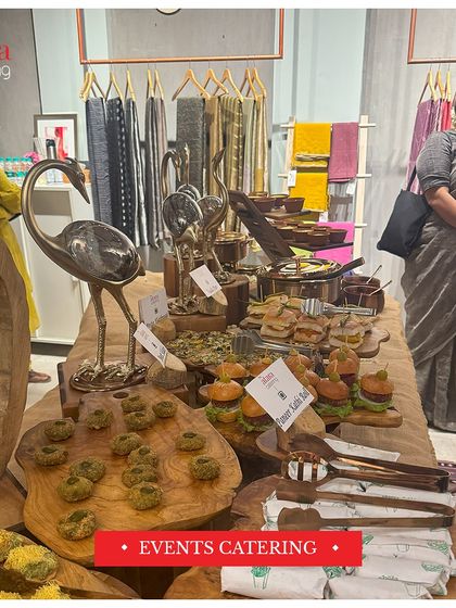 A rustic and chic setup for an event catering at a launch. The use of natural wood platters and decorative elements creates a warm and inviting atmosphere for guests.