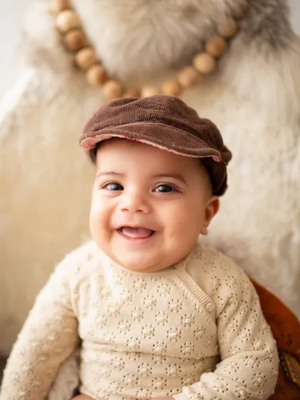 A beautiful close-up of this baby's happy, smiling face.