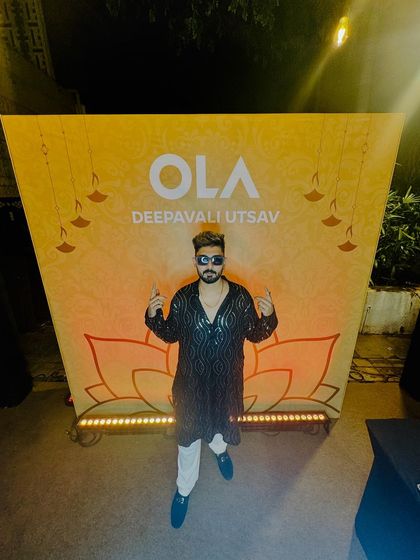 A full-length shot at the OLA event, showcasing the festive setup.