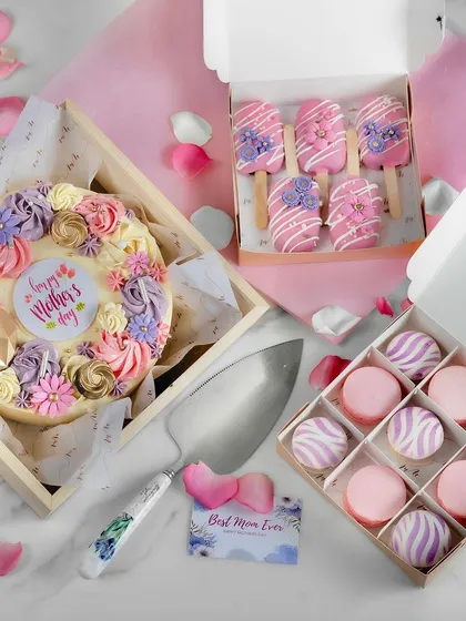 For Mother's Day, I designed a complete gifting collection to celebrate the amazing women in our lives. This spread includes the Sweet Serenade Cake, a box of Divine Macarons, and our floral Sweet Serendipity Cakesicles.