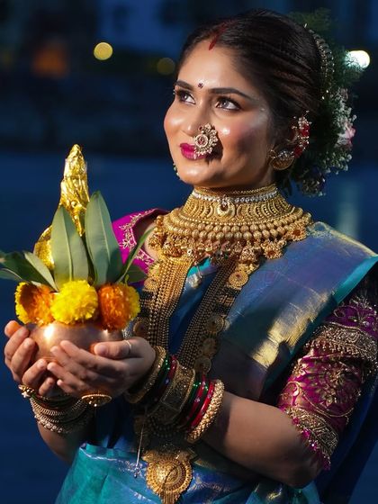 A moment of devotion during Narali Purnima. Her makeup is radiant and her expression serene, capturing the spiritual and cultural significance of the festival.