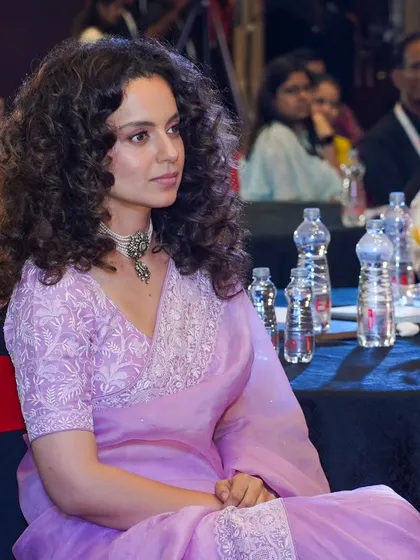 A candid photograph of actress Kangana Ranaut in the audience. I specialize in discreetly capturing high-profile guests and VIPs, ensuring authentic moments are preserved without disrupting the event flow.