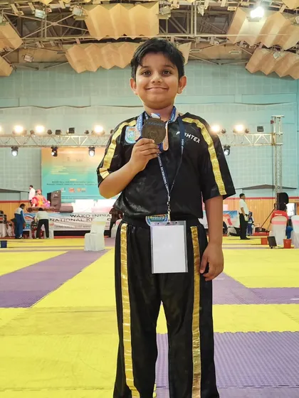 Abeer stands confidently with his national bronze medal. This experience at the WAKO India championship is a stepping stone for his future in the sport.