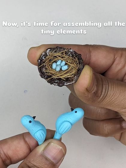 Now, it’s time for assembling all the tiny elements. The birds are placed carefully on the nest with their eggs.