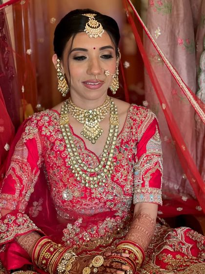 A quiet, elegant pose. The soft lighting enhances the dewy finish of her skin.