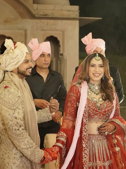 For Kanika’s big day, we embraced soft glam with a touch of royalty. This candid shot captures her radiant smile during the ceremony.