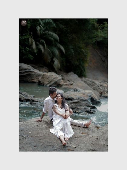 A romantic portrait of a couple by a stream in a lush, green location. This showcases my willingness to travel to find unique and beautiful natural backdrops.