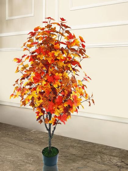 Capture the feeling of autumn with this artificial maple tree. The warm red, orange, and yellow leaves create a cozy and seasonal atmosphere in your home all year round.