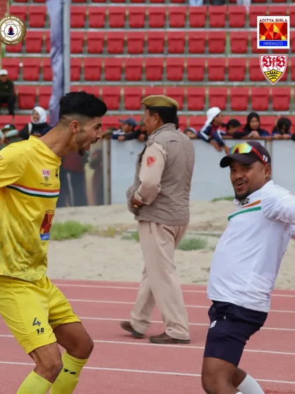 The raw emotion of victory. A player and coach celebrate on the sidelines after a crucial moment in our Climate Cup journey.