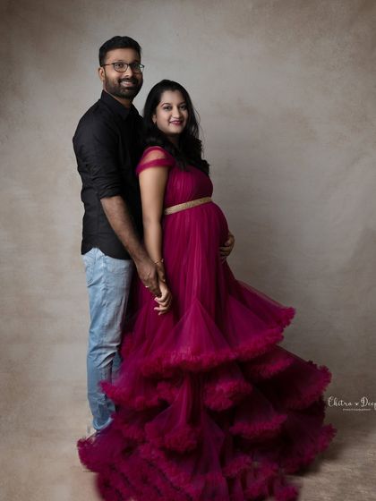 A beautiful couple's portrait showing their loving connection. The twirl of her magenta gown adds a touch of dynamic energy.