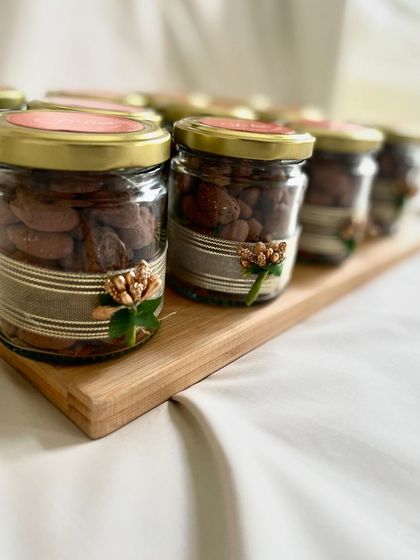 Our chocolate-roasted almond jars, beautifully decorated with custom ribbons and embellishments, make for a sophisticated and delicious corporate gift.