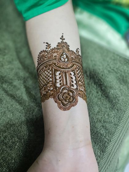 A close-up of the elegant cuff design created for a wedding anniversary celebration.