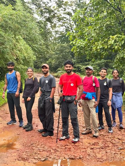 Our trekking team on the muddy trail leading to Dudhsagar falls. Proper trekking gear is a must for this adventurous journey.