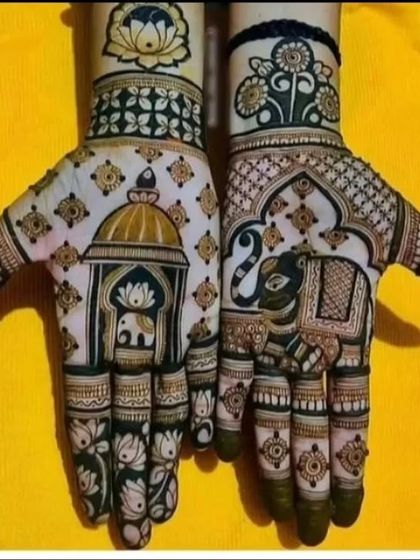 This intricate design features elephants inside decorative frames on the palms, surrounded by beautiful lotus motifs.