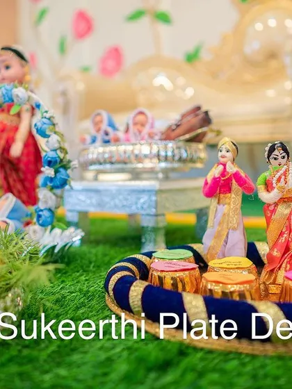 This close-up shows the intricate details of the handmade dolls and the colorful sweets on the platter. I use high-quality materials to ensure everything looks perfect.