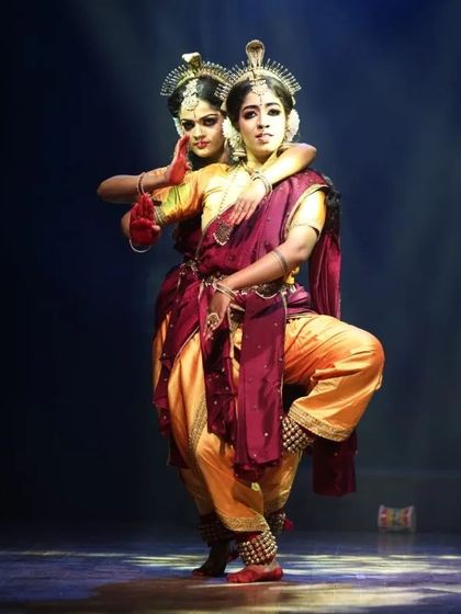 A strong, balanced pose from "Shrishti Stithi Laya". The symmetry and power in this formation reflect the cosmic balance that is a central theme of the production.