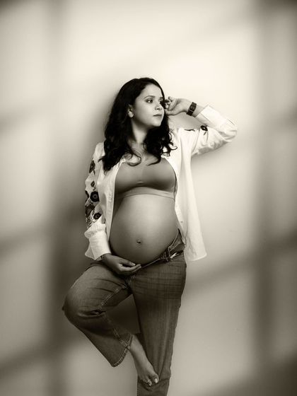 Capturing life's precious moments. This beautiful sepia-toned shot, with its delicate shadows, creates a truly timeless piece of art.