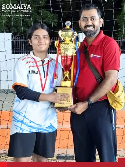 Jidnya Mandar Sawant with her coach and the team trophy, celebrating her selection for the National Roll ball Championship.