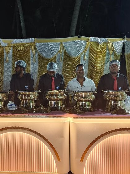 Our uniformed staff posing behind the buffet line, proud and ready to deliver an exceptional dining experience.