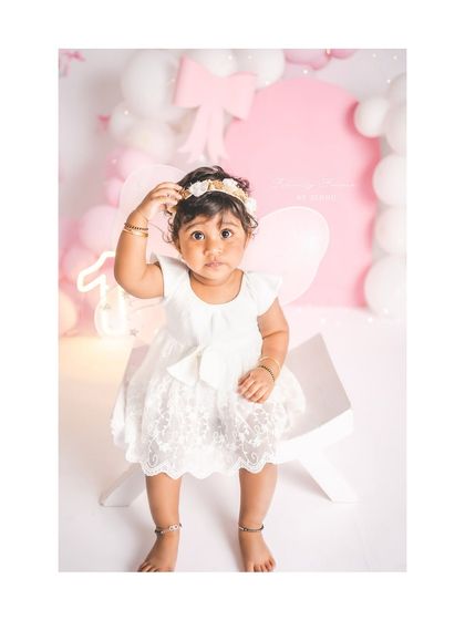 A curious expression from this sweet girl during her first birthday photoshoot. I love capturing all the different facets of their personality.