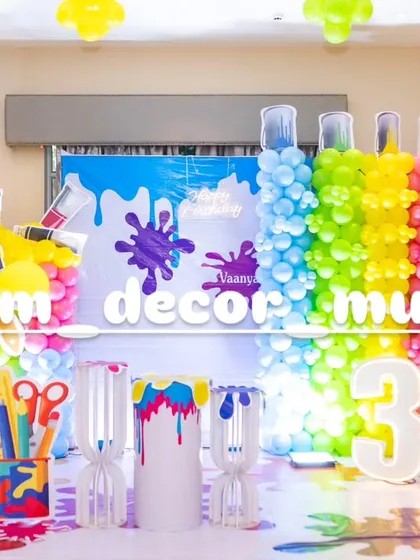 The full view of our Art and Paint party stage, complete with a light-up number '3' and various themed props like scissors and paint palettes.