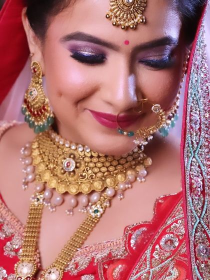The smile of a happy bride says it all. This close up shows the detailed eye makeup and the perfect lip color.
