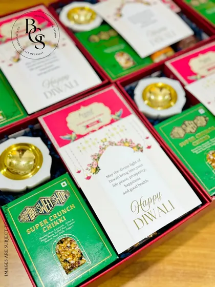 A look inside one of my Diwali gift boxes, featuring traditional Indian sweets (chikki) and elegant marble diyas. I focus on sourcing high-quality, relevant items that enhance the festive experience.