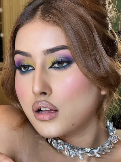 Celestial eyes. This look is a creative blend of yellow, purple, and blue eyeshadows for a colorful and artistic cocktail look.