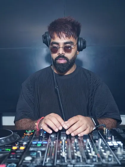 Focused and in the zone. This is me at my workstation, my Pioneer DJ console. I use only industry-standard equipment to ensure the sound is always perfect and the music flows seamlessly.