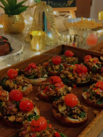 A beautiful tray of Bruschetta with fresh tomato and basil toppings. This classic Italian appetizer is perfect for high-tea events and as a light starter.