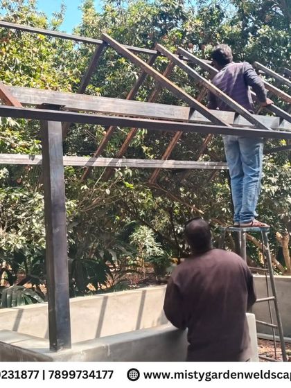 My team works together to assemble the steel roof structure for the cow shed. Every joint is precisely welded to create a single, solid frame.