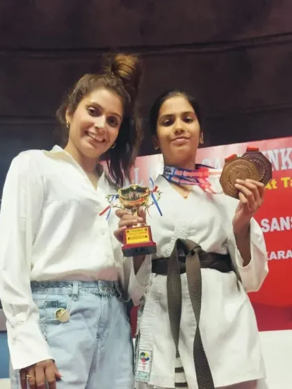 Two of our students celebrating their victories at the Sanshinkan Karate Indoor tournament. It's moments like these that build a strong sense of accomplishment and camaraderie among our young fighters.